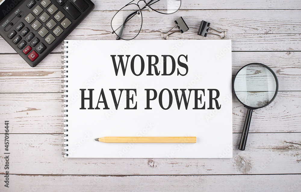Poster blank notebook with text words have power on white background with calculator and office tools.