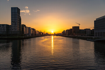 DUBLIN, IRELAND - 12 SEPTEMBER 2021: Sunset at Samuel Beckett Bridge crossing the River Liffey in Dublin, Ireland
