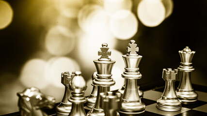 Closeup of chess characters on board games. to represent decision making in term of business strategy to find out the best solution to meet target objective and goal.