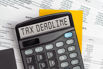 On display of calculator is written TAX DEADLINE