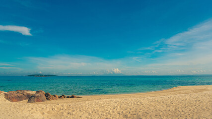 Nature in twilight period which including of sunrise over the sea and the nice beach. Summer beach with blue water and purple sky at the sunset.