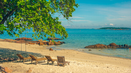 Nature in twilight period which including of sunrise over the sea and the nice beach. Summer beach with blue water and purple sky at the sunset.