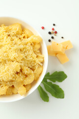Plate with macaroni and cheese on white background