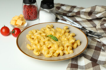 Concept of tasty eating with macaroni with cheese on white background