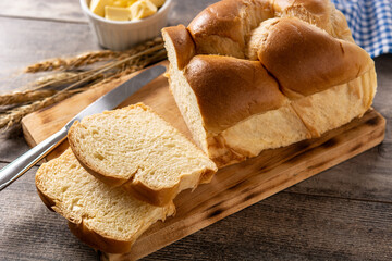 Braided egg bread on wooden table	