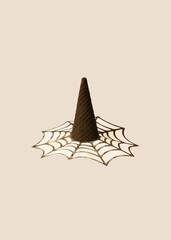 Halloween inspiration design idea.witch black hat made of ice cream cone with spider web decoration.spooky concept