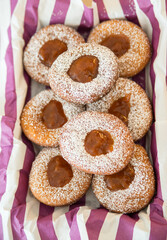 Plate of Fresh Homemade Fried Donuts with jam top view