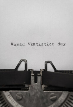 World statistics day typed words on a vintage typewriter vertical
