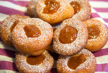 Plate of Fresh Homemade Fried Donuts with jam top view