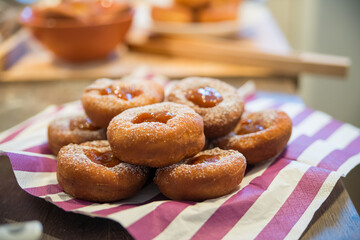 Plate of Fresh Homemade Fried Donuts with jam side view