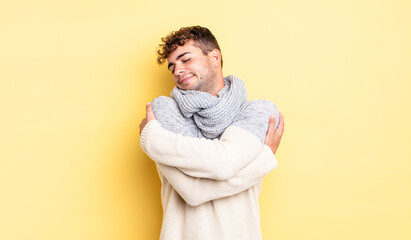 young handsome man feeling in love, smiling, cuddling and hugging self, staying single, being...