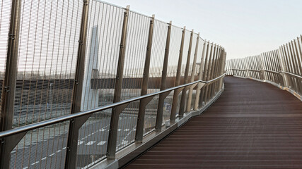 Fototapeta premium architectural detail of a modern wooden and metal bridge