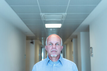 Serious senior business man with piercing blue eyes
