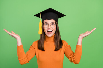 Portrait of attractive dreamy amazed cheerful brown-haired girl bachelor expecting good news isolated over green color background