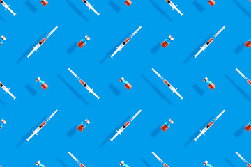 Medical syringes seamless pattern. Background on the theme of medicine, vaccination and human health.