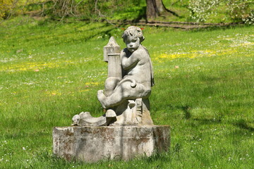 Old sculpture in the city park of the museum