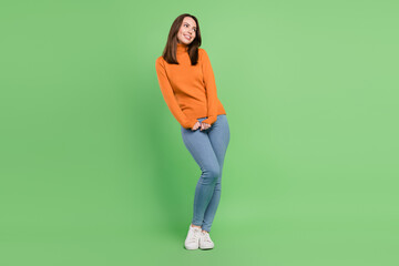 Fototapeta na wymiar Full length body size view of attractive cheerful girlish girl posing thinking copy space isolated over green color background