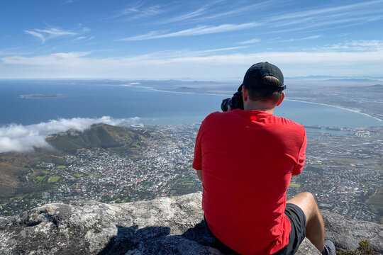 Man taking pictures of Cape Town cityscape.