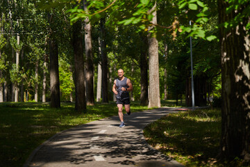 Fototapeta na wymiar Long distance runner training in the park
