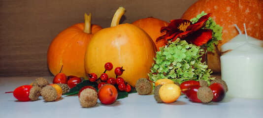 Orange pumpkins for Halloween celebration. Preparing a festive Halloween table