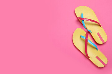 Stylish flip flops on pink background, flat lay. Space for text