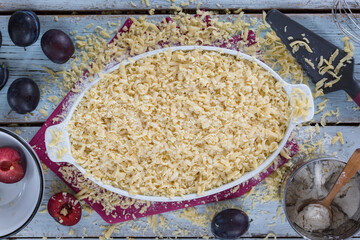 Recipe for organic plum cake, products on the rustic table.