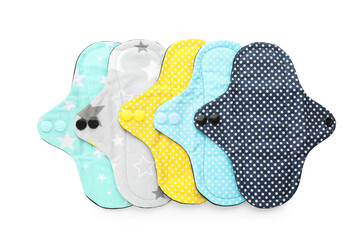 Many cloth menstrual pads on white background, top view. Reusable female hygiene product