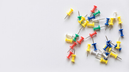 A colorful push pins isolated on a white background with copy space.