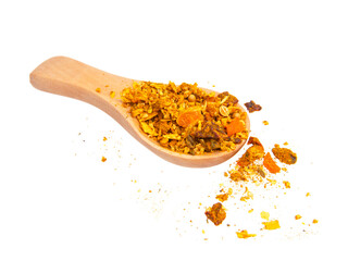 Dried aromatic spices in wooden spoon isolated on the white background