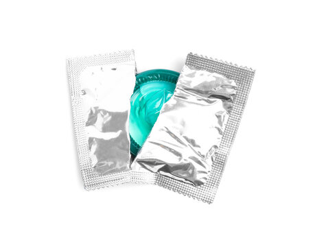 Torn condom package isolated on white, top view. Safe sex