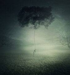 Conceptual scene, a man lifted up and manipulated by a dark cloud, symbol of pessimistic thoughts...