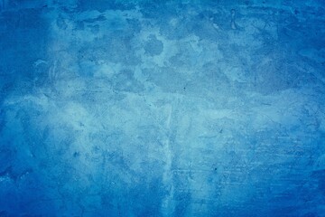 Fototapeta na wymiar Old blue wall in spots, cracks, stains. Painted concrete wall in abstract grunge style loft. Vintage wall background texture for backgrounds, portraits, posters.