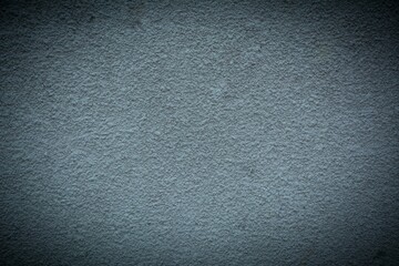 Old black wall in spots, cracks, stains. Painted concrete wall in abstract grunge style loft. Vintage wall background texture for backgrounds, portraits, posters.