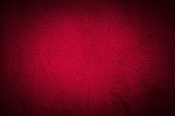 Old red wall in spots, cracks, stains. Painted concrete wall in abstract grunge style loft. Vintage wall background texture for backgrounds, portraits, posters.