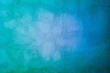 Old blue wall in spots, cracks, stains. Painted concrete wall in abstract grunge style loft. Vintage wall background texture for backgrounds, portraits, posters.