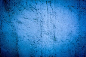 Old blue wall in spots, cracks, stains. Painted concrete wall in abstract grunge style loft. Vintage wall background texture for backgrounds, portraits, posters.