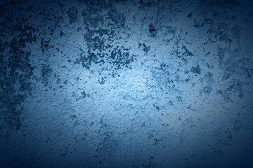 Old blue wall in spots, cracks, stains. Painted concrete wall in abstract grunge style loft. Vintage wall background texture for backgrounds, portraits, posters.