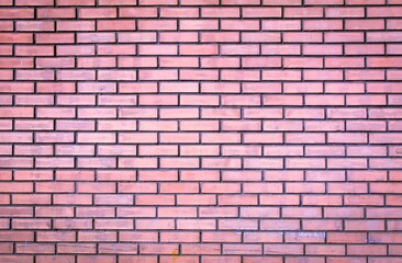 Weathered stained old pink brick wall background