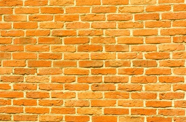 Weathered stained old yellow brick wall background