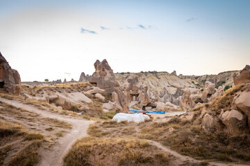 Cappadocia, Turkey - September 1, 2021 - Cappadocia Panoramic - Hot air balloon flying in early morning over rock landscape at Cappadocia Turkey