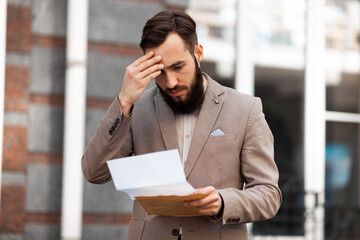 The guy is upset by the statistics of profit growth in his company. The man has a.headache because...