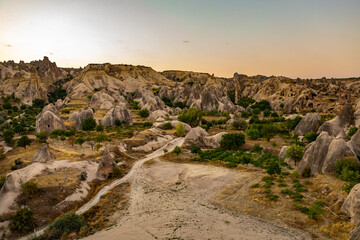 Cappadocia, Turkey - September 1, 2021 - Cappadocia Panoramic - Hot air balloon flying in early...
