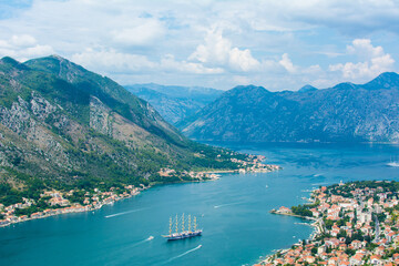 Kotor, Montenegro, August 30, 2018. Beautiful white city shore of a bay with mountains