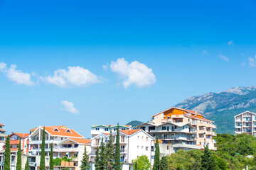 Fototapeta na wymiar Herceg Novi, Montenegro, August 30, 2018. Beautiful modern white houses against the backdrop of mountains and greenery