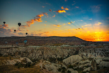 Cappadocia, Turkey - September 1, 2021 - Cappadocia Panoramic - Hot air balloon flying in early...