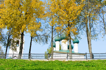Obraz premium Yaroslavl. Russia. September 20, 2020. White Orthodox Christian church against the blue sky. Temple against the background of autumn trees.