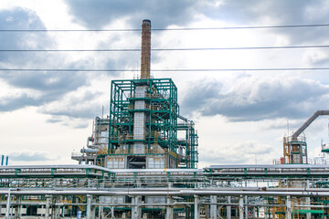 Fototapeta premium Route M6. Russia. May 23, 2021. Oil and gas refinery with pipeline steel fittings. A close-up view of an industrial oil refinery.