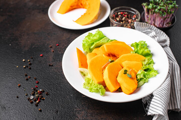 pumpkin slices salad vitamins fresh portion ready to eat meal snack on the table copy space food background rustic. top view keto or paleo diet veggie vegan or vegetarian food