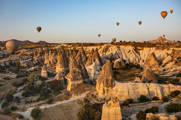 Cappadocia, Turkey - September 1, 2021 - Cappadocia Panoramic - Hot air balloon flying in early...