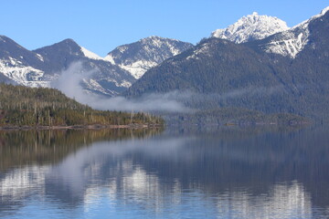 Fototapeta na wymiar Snow capped mountains and a lake on Vancouver Island, British Columbia (BC), Canada